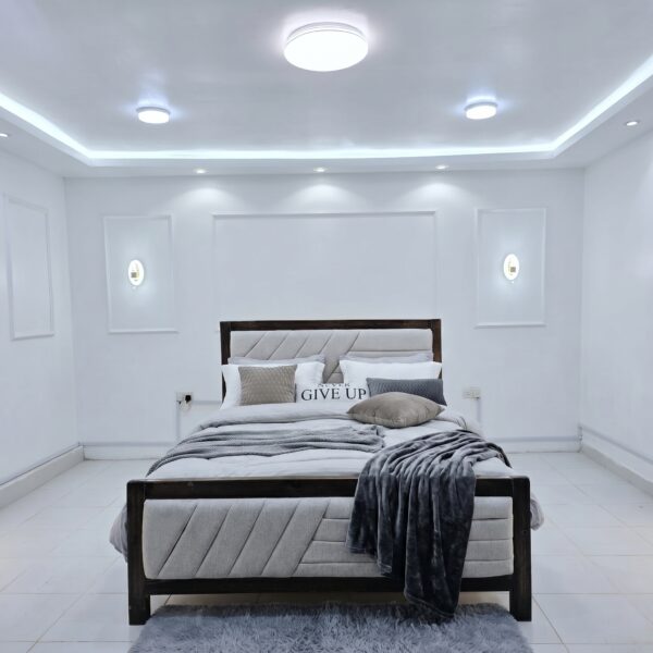 Modern Upholstered Bed Kenya with padded headboard and wooden frame